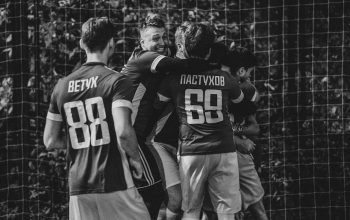 grayscale photography of 2 men in jersey shirt